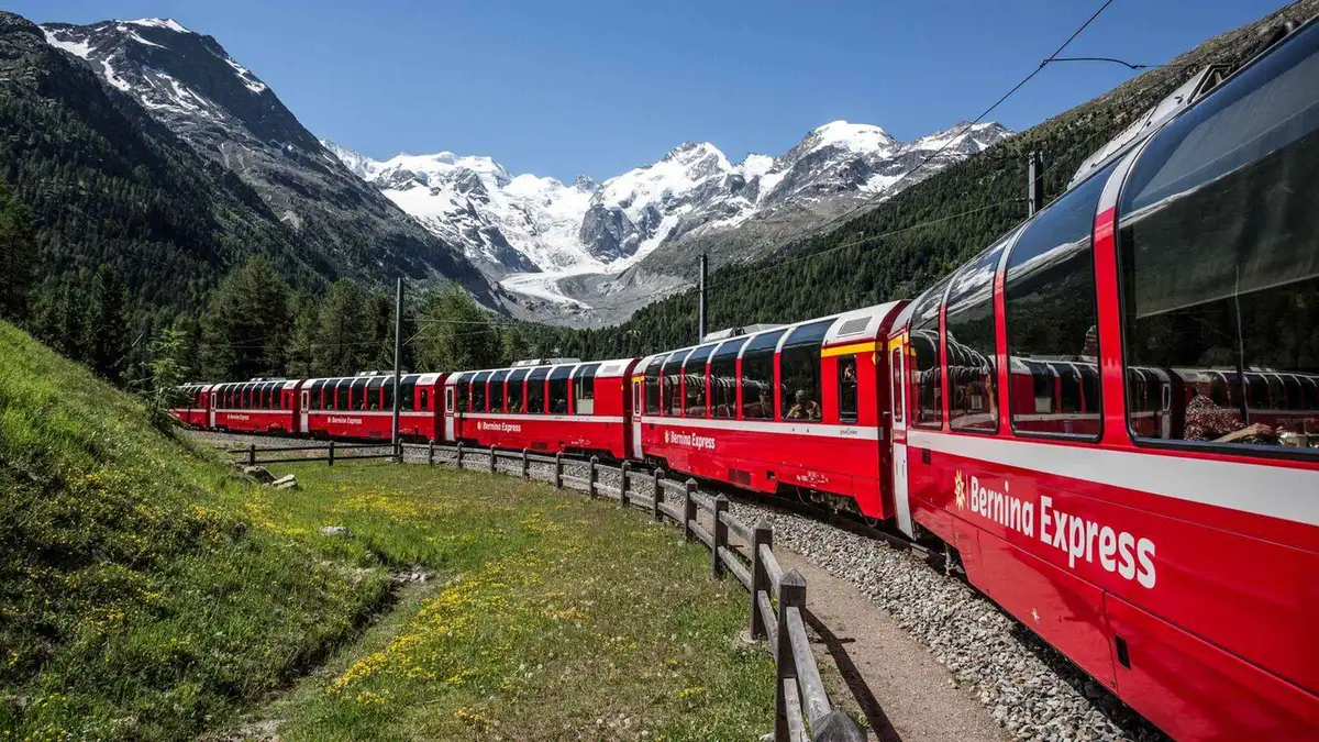 Swiss train crossing a viaduct above the Lauterbrunnen valley on a Swiss Travel Pass route
