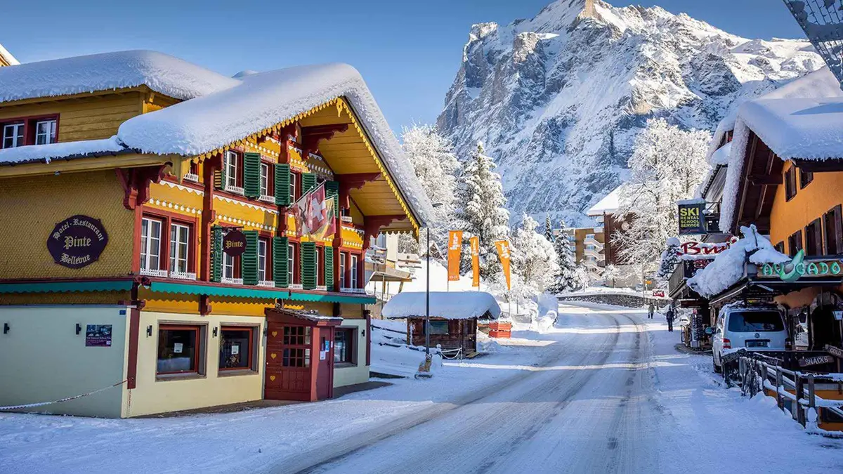 Panoramic hop-on hop-off bus stopped in Lauterbrunnen village