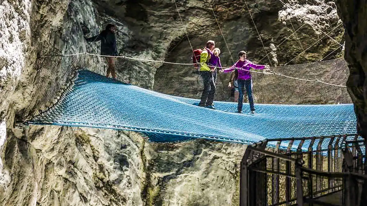Wooden walkway through the rock galleries of Glacier Canyon in Grindelwald