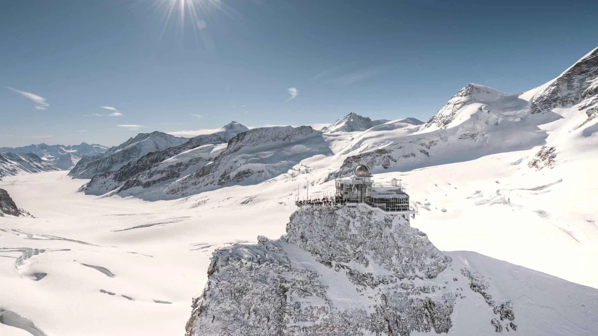 Cogwheel train arriving at the Jungfraujoch station above the Lauterbrunnen valley