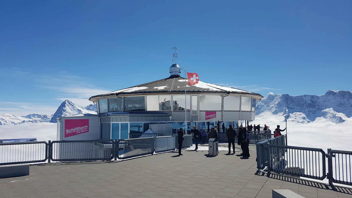 Cable car climbing toward the Schilthorn summit above Mürren and the Lauterbrunnen valley