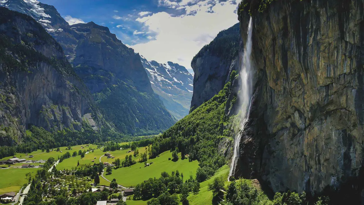 Minibus tour group at Staubbach Falls in Lauterbrunnen village