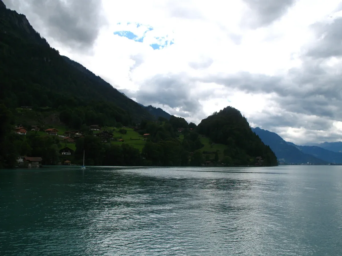 Lake Brienz and its shoreline mountains seen from Iseltwald in Switzerland