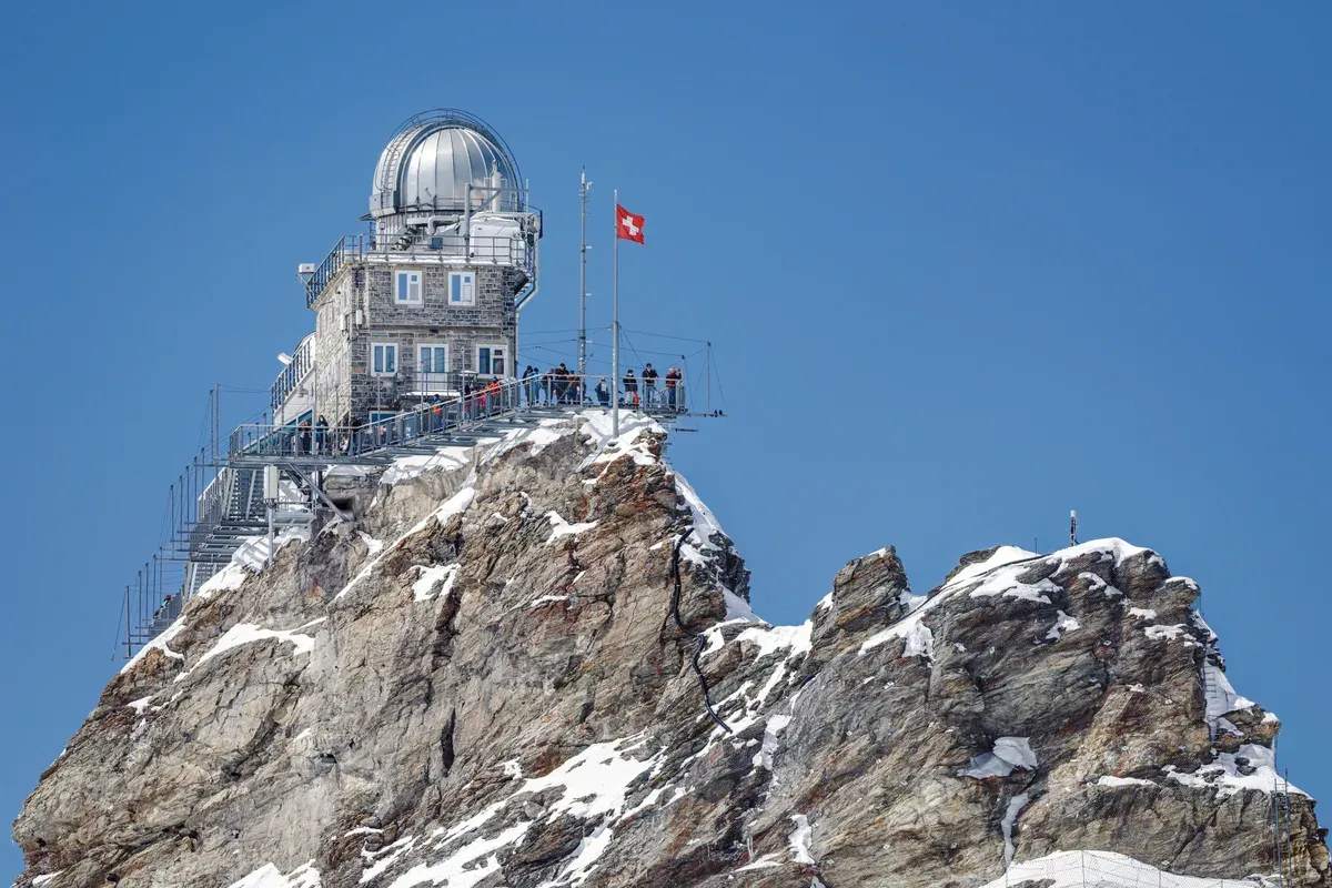 The Sphinx Observatory dome on its rock spire at the Jungfraujoch, the highest railway station in Europe above the Lauterbrunnen valley, Switzerland