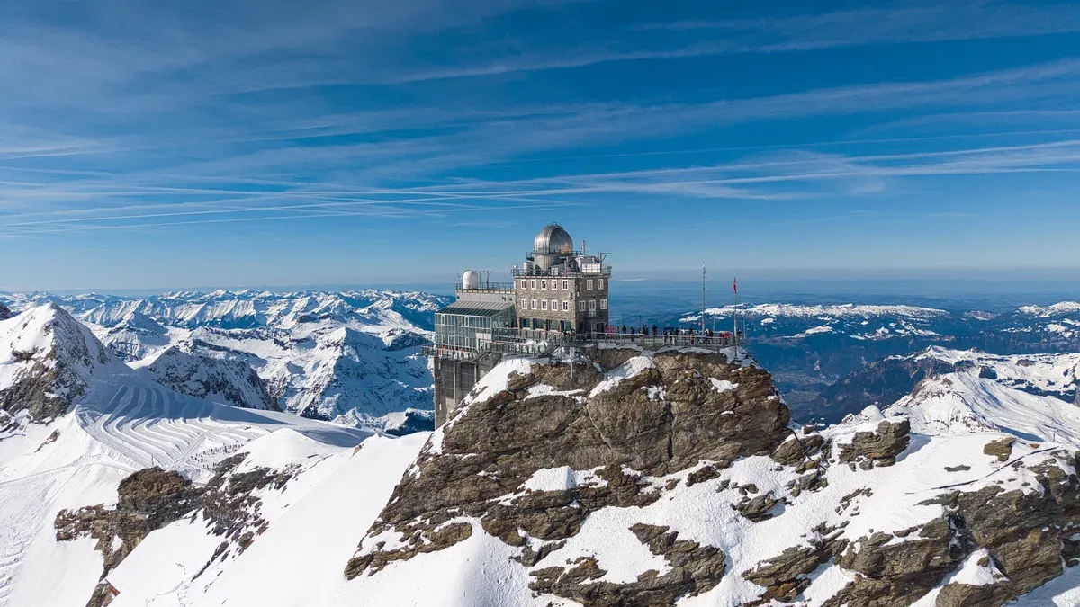The Sphinx Observatory on the Jungfraujoch summit above deep February snow near Lauterbrunnen, Switzerland